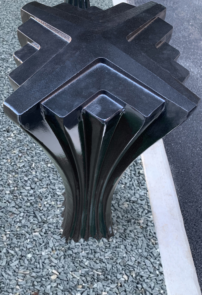 Decorative cast aluminum bollard with powder coat finish and unique geometric relief
