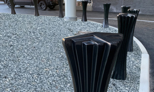 Decorative cast aluminum bollard with powder coat finish and unique geometric relief