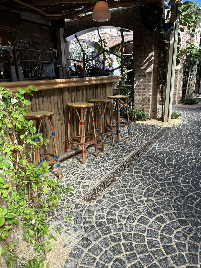 Cast iron trench drain grates in decorative Minnione pattern