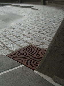 Decorative cast iron drain grate in Oblio pattern