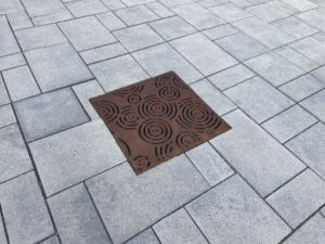Decorative cast iron drain grate in Oblio pattern