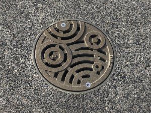 Decorative 6 inch diameter drain grate in Iron Age Design's Oblio pattern