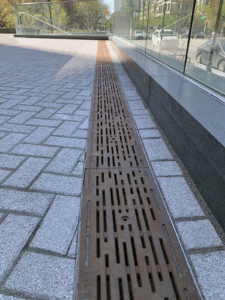 Decorative cast iron trench grate in Rain pattern