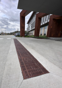 Decorative cast iron trench grate in Rain pattern