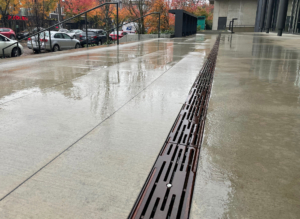 Decorative cast iron trench grate in Rain pattern