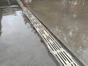 Cast aluminum decorative trench grate installed in entry plaza to Climate Pledge Arena