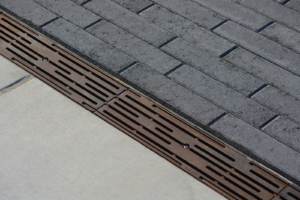 Decorative cast iron trench grate in Rain pattern