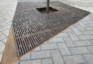 Decorative cast iron tree grate with Rain pattern