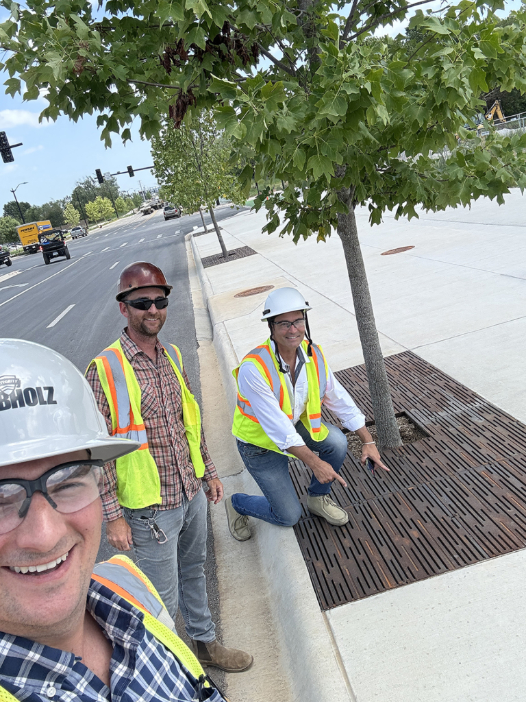 Cast iron tree grate in decorative Rain pattern by Iron Age Designs. Streetscape installation.