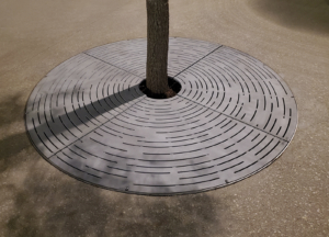 Decorative cast aluminum tree grate with concentric circular 'Spin' design