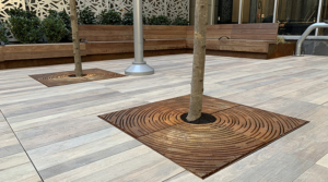 Decorative cast iron tree grate with concentric circular 'Spin' design
