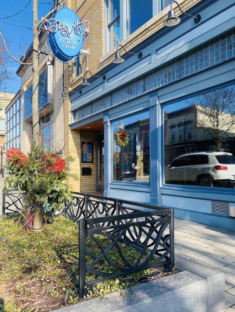 Decorative cast metal planter fence in Belle pattern from Iron Age Designs. With black powder coat finish.