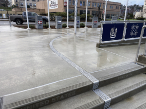 Cast aluminum radius trench drain grates in decorative Interlaken pattern