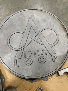 Cast Iron plaque with logo for Alpha Loop trail system in Alpharetta, GA