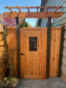 Cast iron grate with Locust pattern, inset into wooden gate