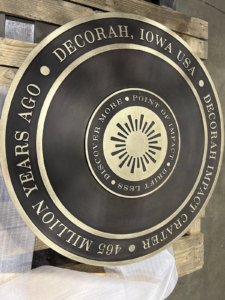 4' dia. cast bronze plaque with patina finish. 18" changeable center insert.