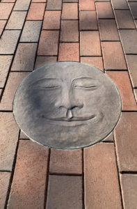 Cast bronze Moon Face embed plaque showing Full Moon face