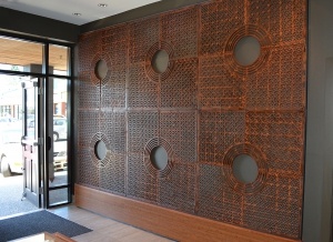 Cast Iron tree grates in Interlaken pattern installed as wall decor