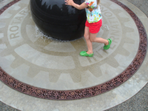 Cast iron radius trench grates in Dynamo pattern around a waterpark fountain
