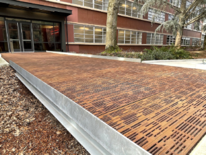 Cast metal pedestrian bridge installed in front of university building