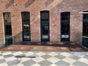 Pedestrian bridge made from decorative cast iron panels with light holes.