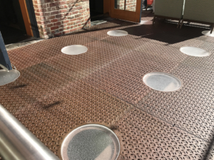 Pedestrian bridge made from decorative cast iron panels with light holes.