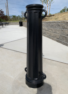 Cast aluminum bollard with black powder coat finish, featuring classic "Main Street" design