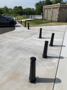 Cast aluminum bollard with black powder coat finish, featuring classic "Main Street" design