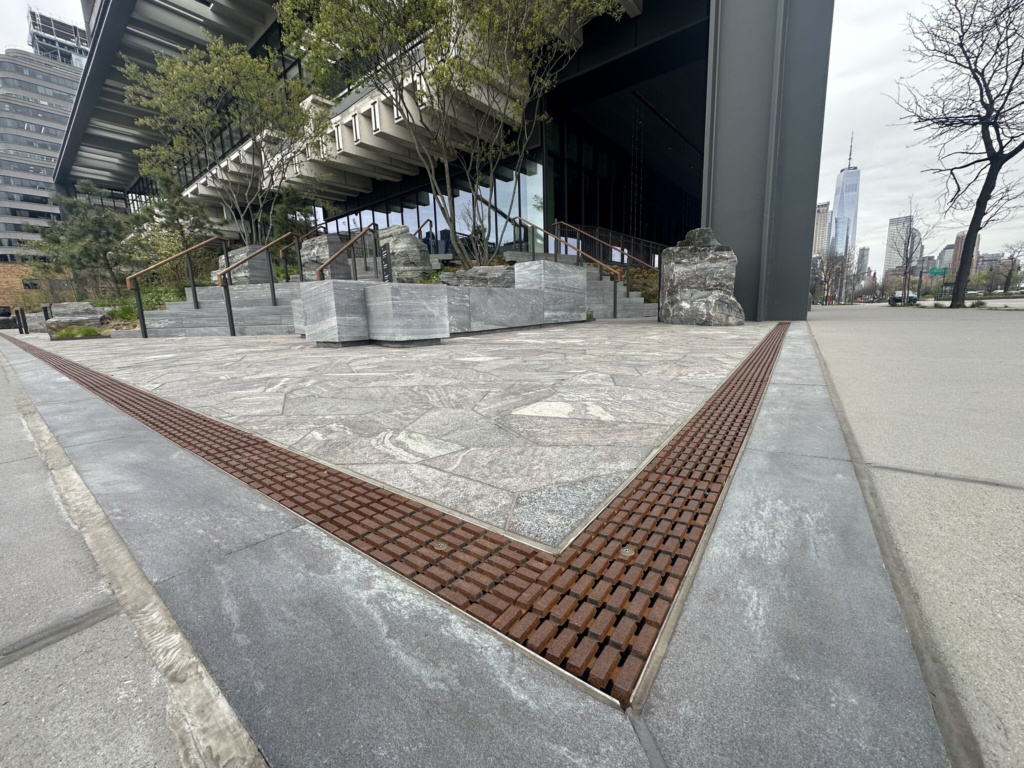 Cast iron trench grates in decorative Plex pattern from Iron Age Designs.