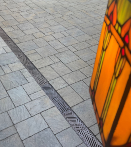 Decorative cast iron trench grates with southwest influenced Thunderbird pattern