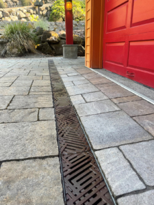 Decorative cast iron trench grates with southwest influenced Thunderbird pattern