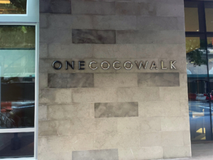 Cast bronze building letters, some shown with patina and some with high polish