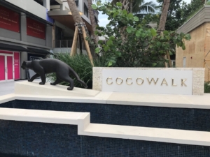 Cast bronze letters with high polish installed as part of a shopping area fountain