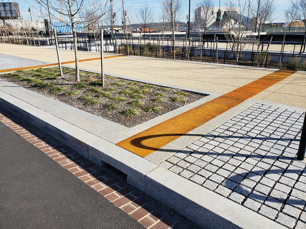 Cast iron solid utility cover with modern Urban Rhythms pattern.