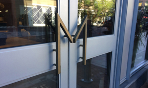 Cast bronze door pull in M shape
