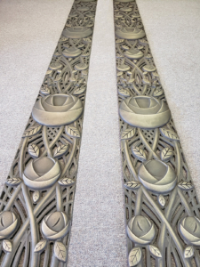 Decorative cast bronze panels with art deco rose design for sides of entry doors