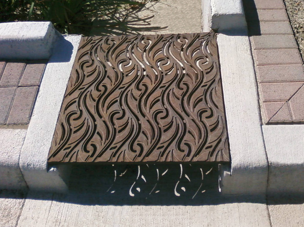 Cast iron grate in decorative Minnione pattern by Iron Age Designs.