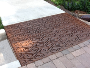 Cast iron grate in decorative Minnione pattern by Iron Age Designs.