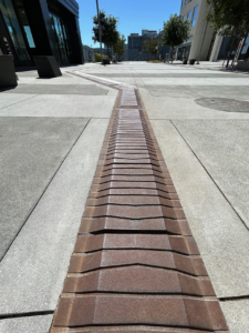 Decorative DWP / Wayfinding Tiles made from cast iron by Iron Age Designs