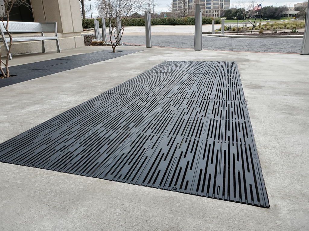 Cast iron grates in decorative Rain pattern by Iron Age Designs. Black powder coat finish.