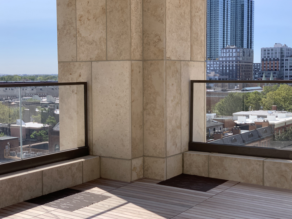 Cast iron grate in decorative Rain pattern by Iron Age Designs. Baked-on-oil finish. Rooftop deck installation.