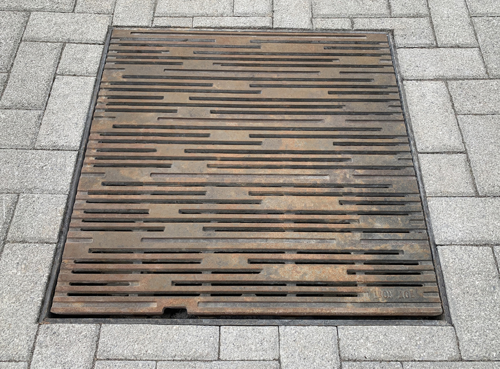 Cast iron grate in decorative Rain pattern by Iron Age Designs.