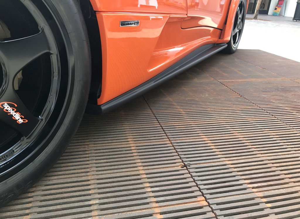 Cast iron grate in Regular Joe pattern by Iron Age Designs. Arrayed to create large format grate.