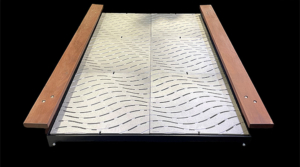 Cast aluminum grates in decorative Ripple pattern by Iron Age Designs. Arrayed as pedestrian bridge.