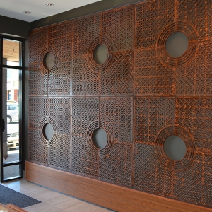 Cast Iron tree grates in Interlaken pattern installed as wall decor