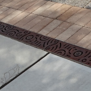 Project: Center Lake Park, Oviedo, FL Design: Dix.Hite + Partners Oblio 5" x 20" Heel Proof Trench Grate, cast iron with Baked-On-Oil Finish