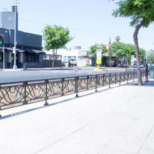 Decorative cast iron planter fence in Belle pattern with black powder coat finish.