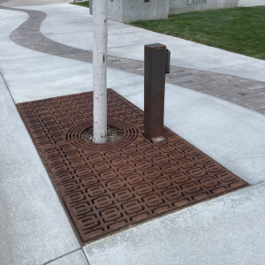 Decorative cast iron tree grate in Carbochon pattern.