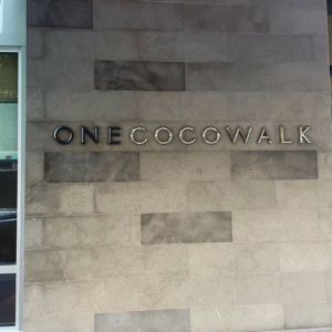 Cast bronze building letters, some shown with patina and some with high polish