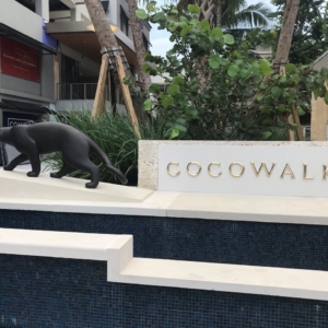 Cast bronze letters with high polish installed as part of a shopping area fountain